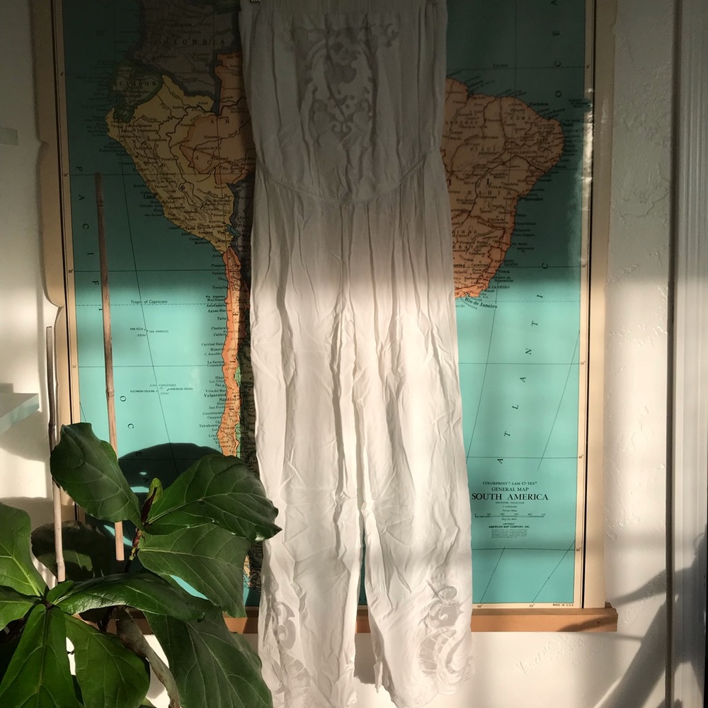 Solitaire white jumpsuit with lace cutouts